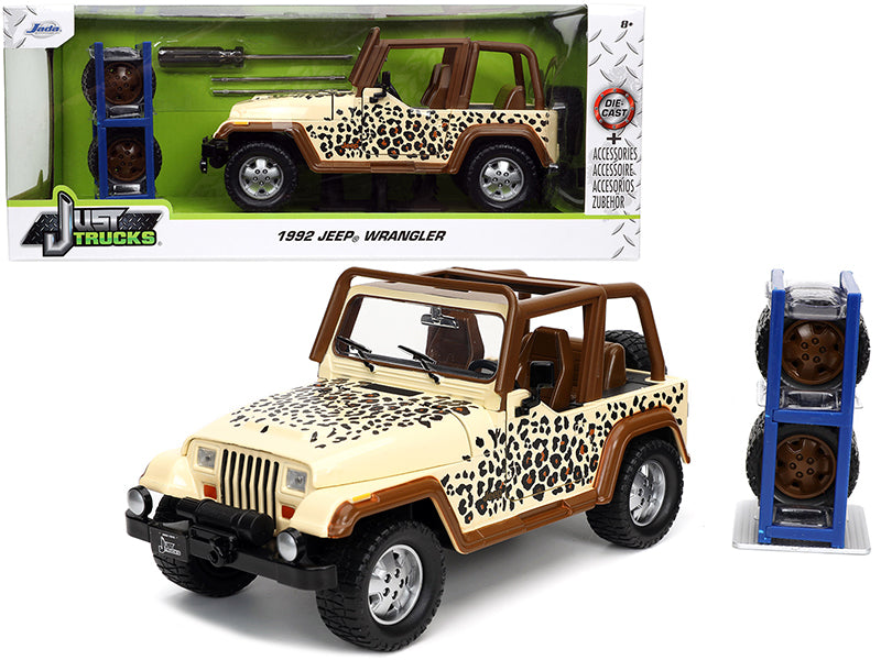 1992 Jeep Wrangler Tan and Brown with Graphics and Extra Wheels "Just Trucks" Series 1/24 Diecast Model Car by Jada-DiecastModeler.com