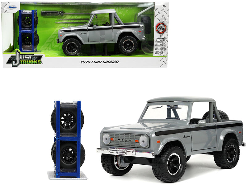 1973 Ford Bronco Pickup Truck Gray with Black Stripes with Extra Wheels "Just Trucks" Series 1/24 Diecast Model Car by Jada-DiecastModeler.com