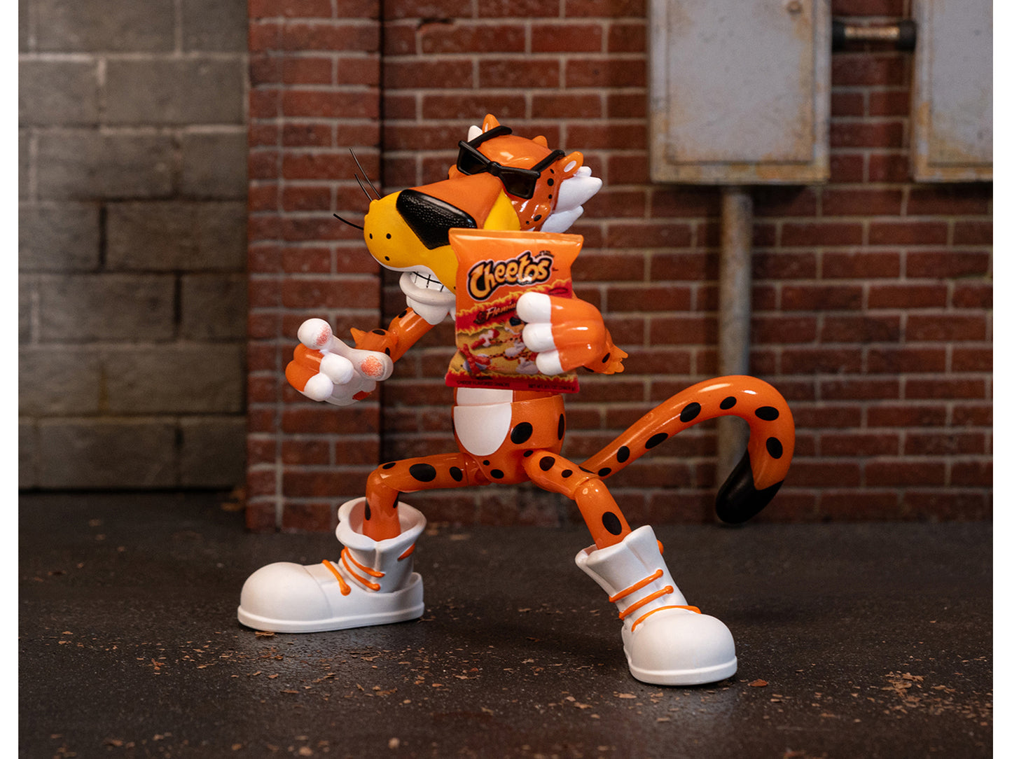 Chester Cheetah 5.5" Glow-in-the-Dark Figure with Accessories and Alternate Head and Hands "Flamin' Hot Cheetos Crunchy" Model by Jada-DiecastModeler.com