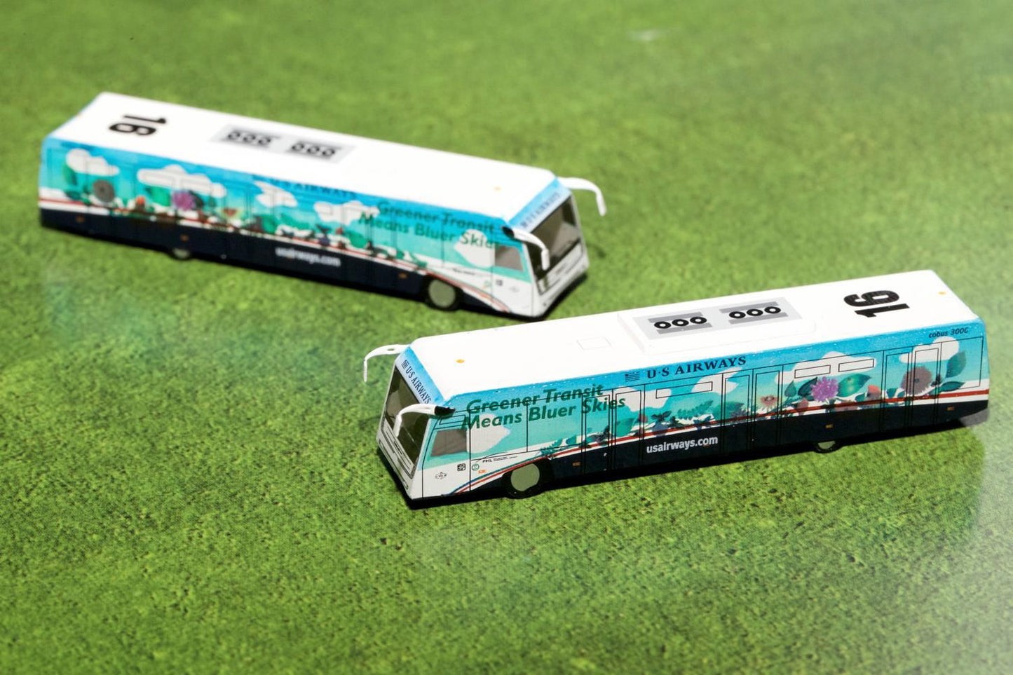 Cobus 3000 Passenger Bus White and Blue with Graphics "US Airways Shuttle Bus - Greener Transit" 2 Piece Set "Gemini 200" Series Diecast Models by GeminiJets-DiecastModeler.com