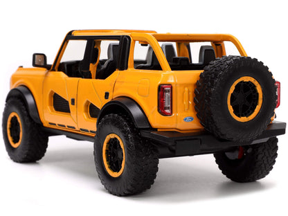 2021 Ford Bronco Orange Metallic with Extra Wheels "Just Trucks" Series 1/24 Diecast Model Car by Jada-DiecastModeler.com