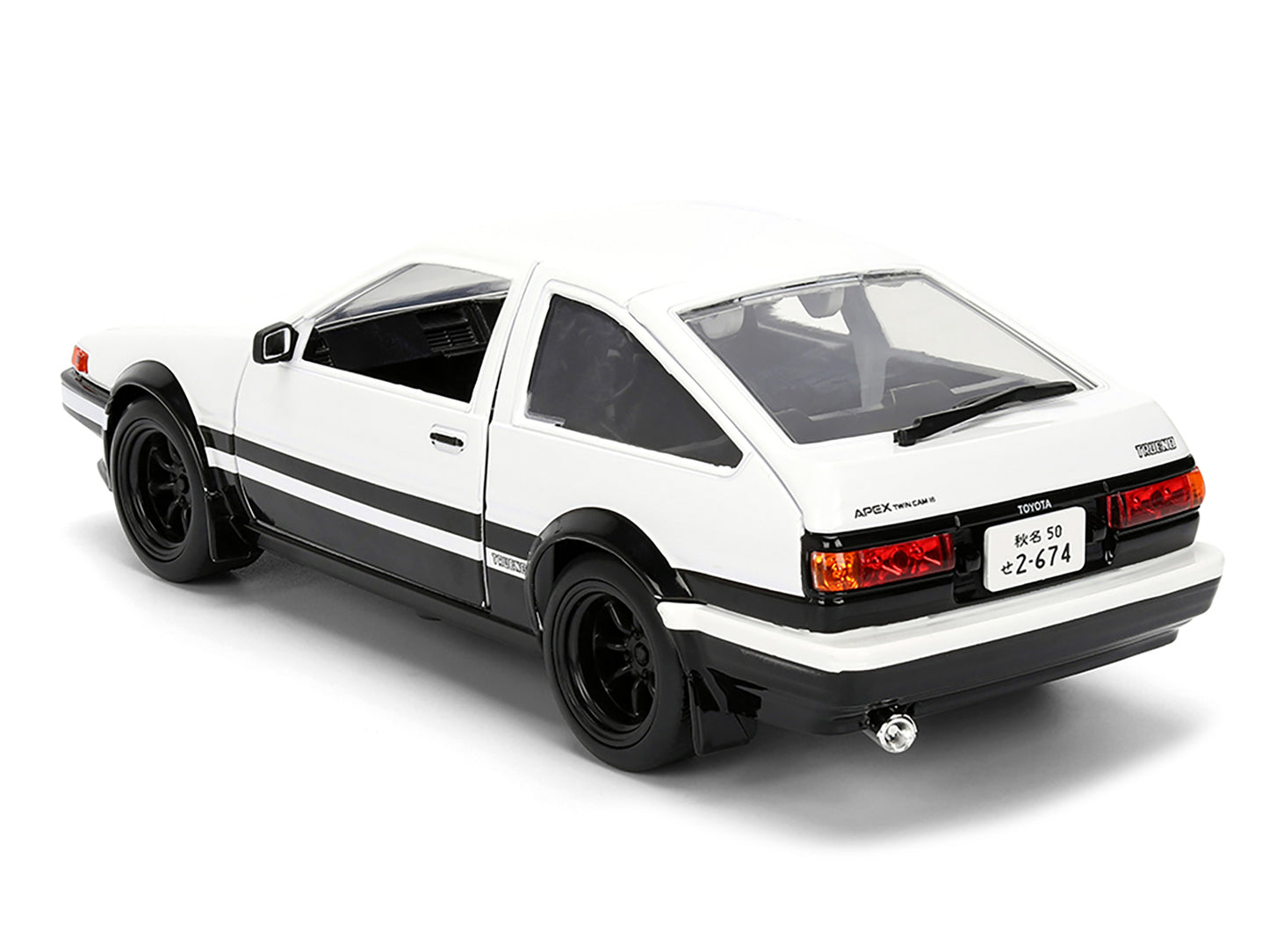 Toyota Trueno (AE86) RHD (Right Hand Drive) White and Black with Graphics and Takumi Diecast Figure "Initial D" (1998-2021) TV Series "Anime Hollywood Rides" Series 1/24 Diecast Model by Jada
