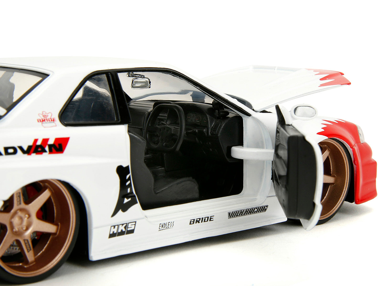 2002 Nissan Skyline GT-R (R34) RHD (Right Hand Drive) White with Red Graphics and Ryu Diecast Figure "Street Fighter" Video Game "Anime Hollywood Rides" Series 1/24 Diecast Model Car by Jada-DiecastModeler.com