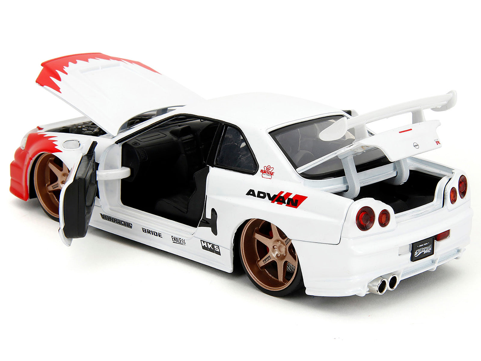 2002 Nissan Skyline GT-R (R34) RHD (Right Hand Drive) White with Red Graphics and Ryu Diecast Figure "Street Fighter" Video Game "Anime Hollywood Rides" Series 1/24 Diecast Model Car by Jada-DiecastModeler.com