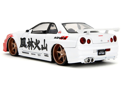 2002 Nissan Skyline GT-R (R34) RHD (Right Hand Drive) White with Red Graphics and Ryu Diecast Figure "Street Fighter" Video Game "Anime Hollywood Rides" Series 1/24 Diecast Model Car by Jada-DiecastModeler.com