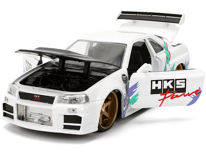 2002 Nissan Skyline GT-R (R34) RHD (Right Hand Drive) "HKS Power" White with Carbon Hood and Graphics "JDM Tuners" Series 1/24 Diecast Model Car by Jada-DiecastModeler.com