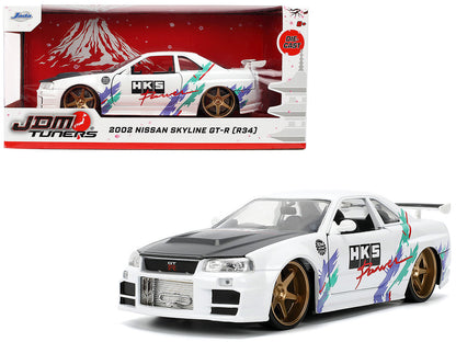 2002 Nissan Skyline GT-R (R34) RHD (Right Hand Drive) "HKS Power" White with Carbon Hood and Graphics "JDM Tuners" Series 1/24 Diecast Model Car by Jada-DiecastModeler.com