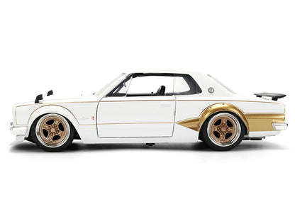 1971 Nissan Skyline 2000GT-R RHD (Right Hand Drive) White with Gold Graphics "JDM Tuners" Series 1/24 Diecast Model Car by Jada