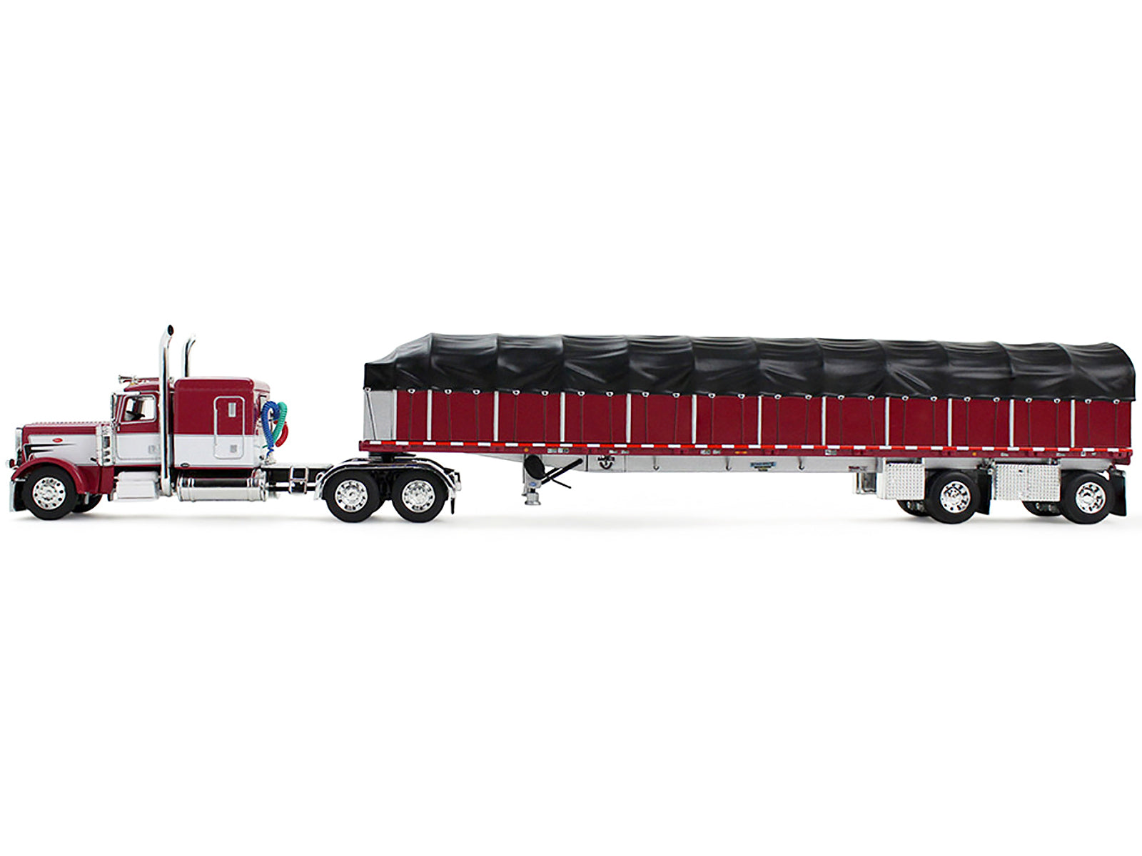 Peterbilt 389 with 63" Flat Top Sleeper and 53’ Wilson Roadbrute Flatbed Trailer with Covered Wagon Maroon with White Stripes 1/64 Diecast Model by DCP/First Gear-DiecastModeler.com