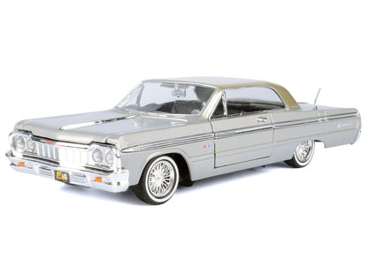 1964 Chevrolet Impala Lowrider Hard Top Silver Metallic with Gold Metallic Top "Get Low" Series 1/24 Diecast Model Car by Motormax-DiecastModeler.com