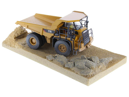 CAT Caterpillar 770 Off-Highway Truck Yellow (Weathered) with Operator "Weathered" Series 1/50 Diecast Model by Diecast Masters-DiecastModeler.com