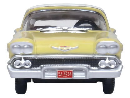 1958 Chevrolet Impala Sport Colonial Cream with Snowcrest White Top 1/87 (HO) Scale Diecast Model Car by Oxford Diecast-DiecastModeler.com