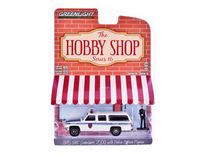 1985 GMC Suburban 2500 "New York City Transit Police Department" White with Blue Stripes and Police Officer Figure "The Hobby Shop" Series 16 1/64 Diecast Model Car by Greenlight-DiecastModeler.com