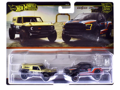 Ford Bronco R Gold Metallic and Black and 2017 Ford F-150 Raptor Pickup Truck #17 Black with Stripes "Car Culture" Set of 2 Cars Diecast Model Cars by Hot Wheels-DiecastModeler.com
