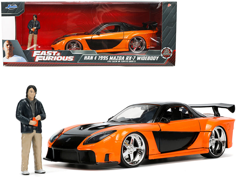 1995 Mazda RX-7 Widebody RHD (Right Hand Drive) Orange Metallic and Black with Han Diecast Figurine "The Fast and the Furious: Tokyo Drift" (2006) Movie 1/24 Diecast Model Car by Jada-DiecastModeler.com