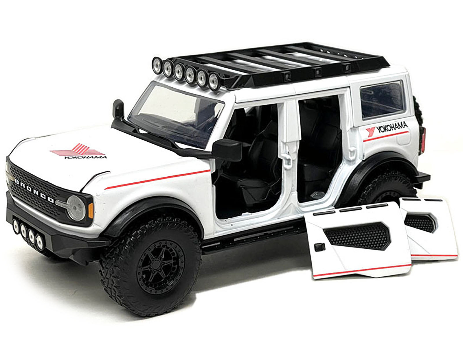 2021 Ford Bronco White with Red Stripes and Roof Rack "Yokohama Tires" "Just Trucks" Series 1/24 Diecast Model Car by Jada-DiecastModeler.com