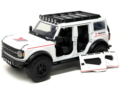2021 Ford Bronco White with Red Stripes and Roof Rack "Yokohama Tires" "Just Trucks" Series 1/24 Diecast Model Car by Jada-DiecastModeler.com