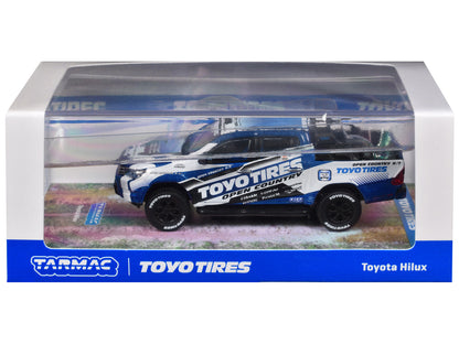 Toyota Hilux Pickup Truck RHD (Right Hand Drive) "Toyo Tires" White and Blue with Graphics "Hobby64" Series 1/64 Diecast Model Car by Tarmac Works