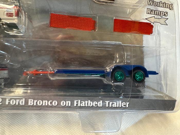 Hitch & Tow - Ford F-150 Pickup Truck and Ford Bronco with Flatbed Trailer BFGR (GREEN)-DiecastModeler.com