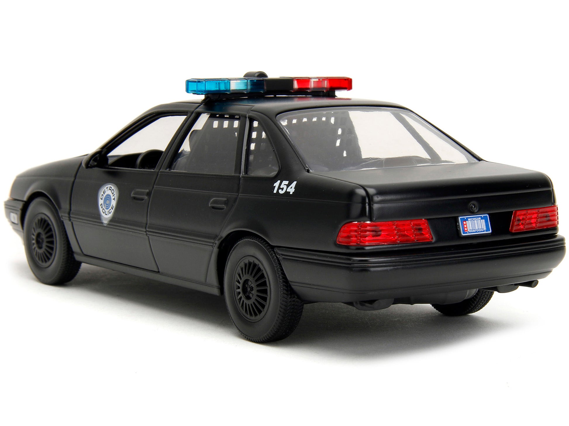 Ford Taurus OCP Matt Black "Detroit Police" and Robocop Diecast Figure 35th Anniversary "Robocop" (1987) Movie "Hollywood Rides" Series 1/24 Diecast Model Car by Jada-DiecastModeler.com