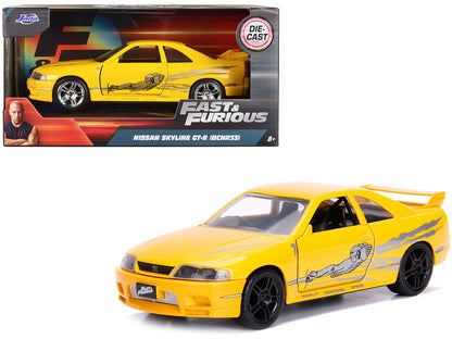 Leon's Nissan Skyline GT-R (BCNR33) Yellow Metallic with Graphics "Fast & Furious" Series 1/32 Diecast Model Car by Jada-DiecastModeler.com