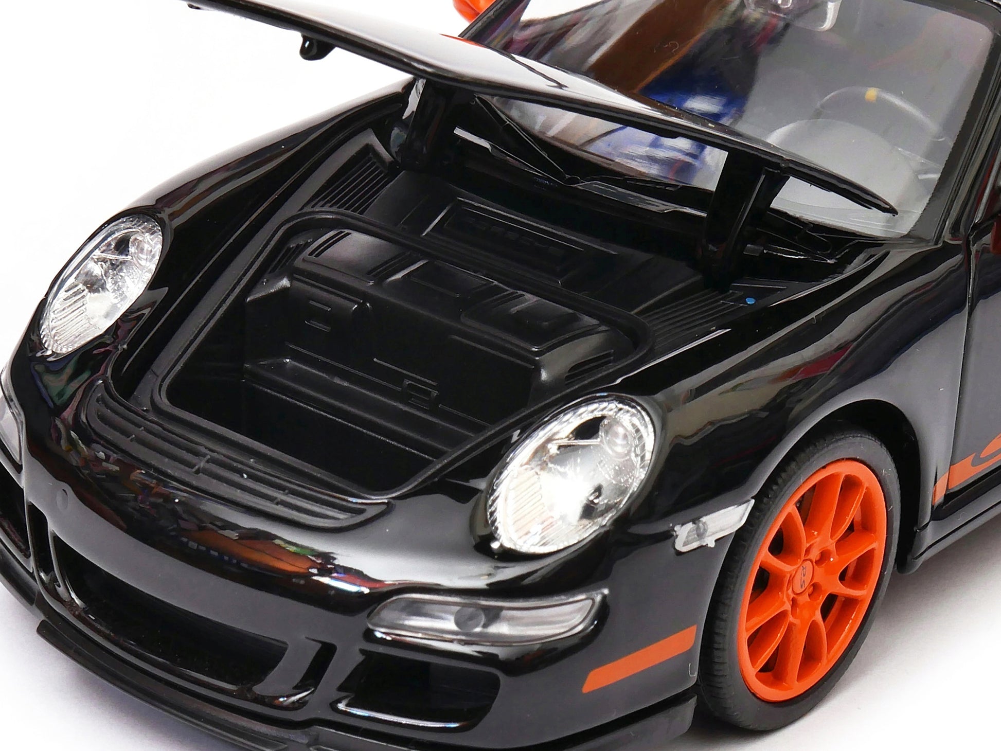 Porsche 911 (997) GT3 RS Black with Orange Accents 1/24-1/27 Diecast Model Car by Welly-DiecastModeler.com